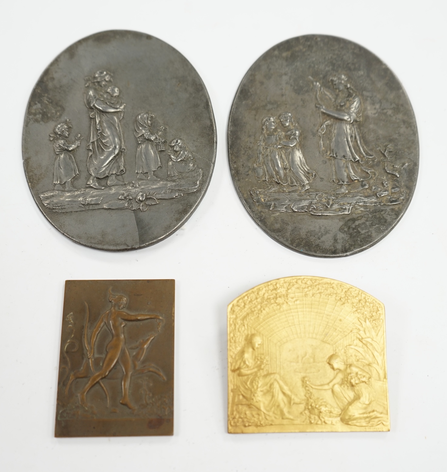 A pair of oval cast pewter plaques inscribed L. Jewitt, Duffield, and two relief-moulded brass plaques, signed Sporrong, Stockholm and G. De Vreese, oval plaques 13cm high. Condition - some marks to surface